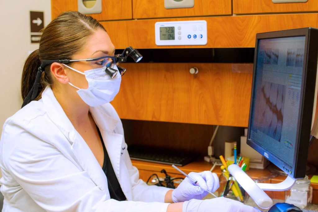 dr-doctor-jessie-vaughn-looking-at-her-computer--Vaughn-Family-Dental-Best-Dentist-in-Independence-Missouri-MO